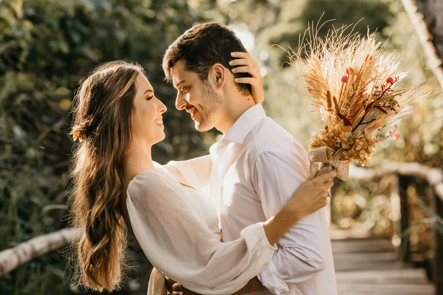 Man in white dress shirt holding brown flower bouquet