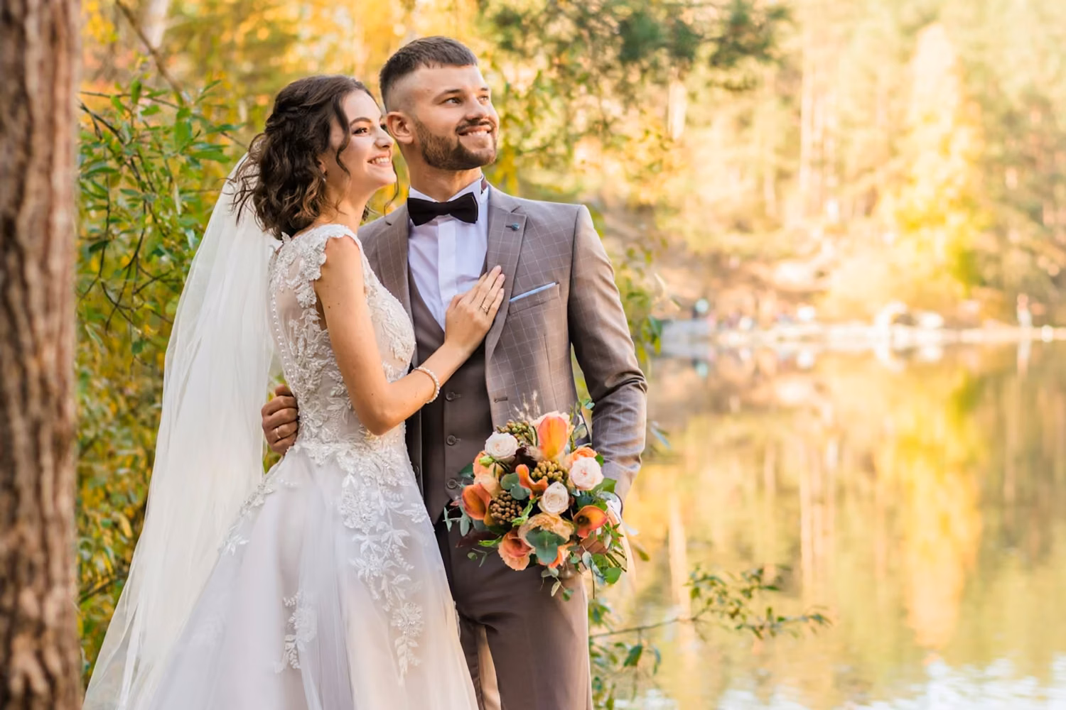 Man in gray suit and woman in white wedding dress