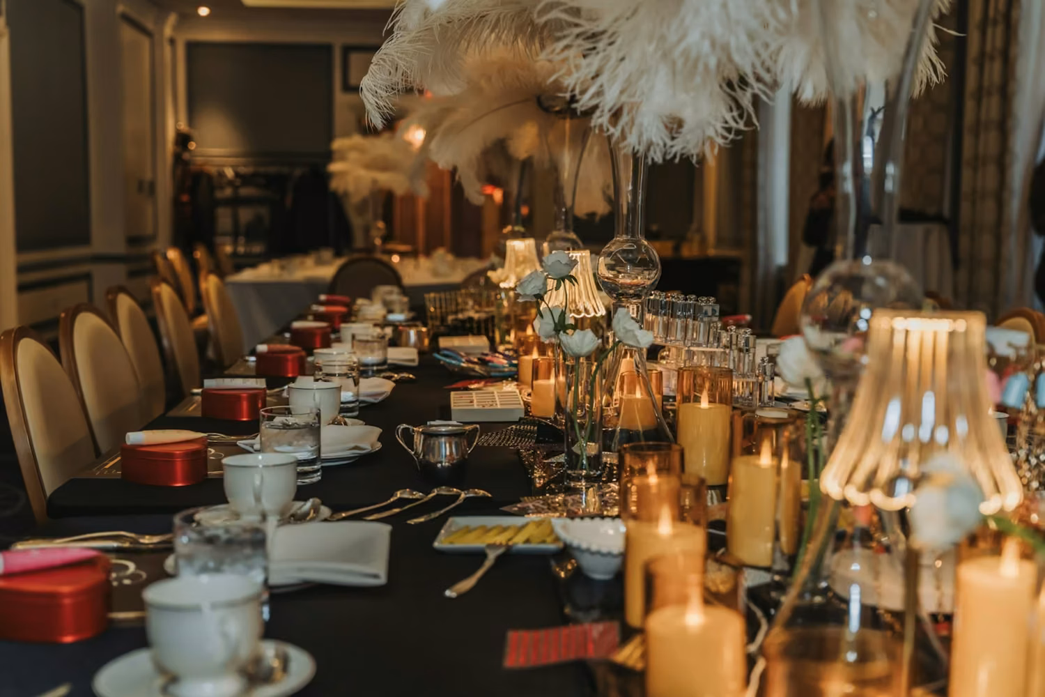 Elegant table setting with candles and teacups