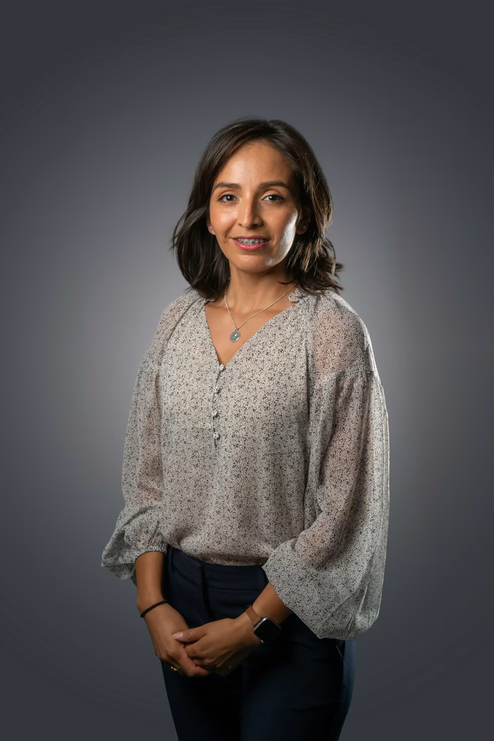 A person with a grey sweater