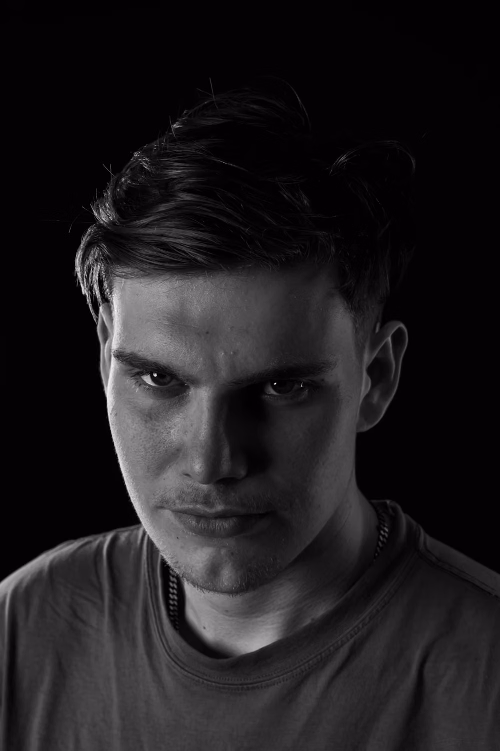 A man with a serious look on his face